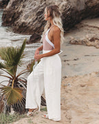 Linen wide-leg pants shown in a dark color